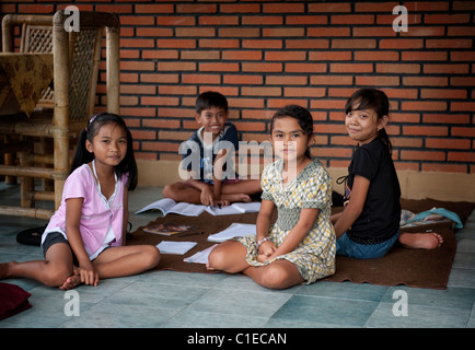 Smiling and happy Balinese children from a village in east Bali called Sideman. Stock Photo