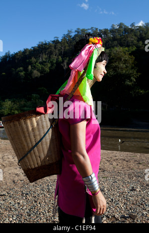 Long Neck Karen woman back to the refugee village from small Veg. farm, Huay Pu Keng, Mae Hong Son, Thailand Stock Photo