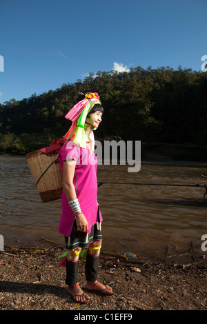 Long Neck Karen woman back to the refugee village from small Veg. farm, Huay Pu Keng, Mae Hong Son, Thailand Stock Photo