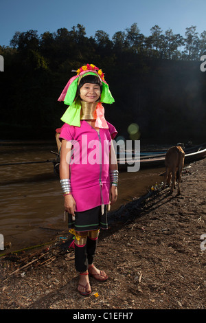 Long Neck Karen woman back to the refugee village from small Veg. farm, Huay Pu Keng, Mae Hong Son, Thailand Stock Photo