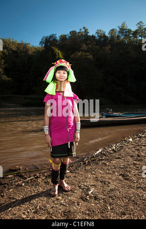 Long Neck Karen woman back to the refugee village from small Veg. farm, Huay Pu Keng, Mae Hong Son, Thailand Stock Photo