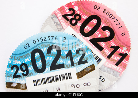 New car tax disc expiring on 29th February 2012 leap year with old expired disc. England, UK, Britain Stock Photo