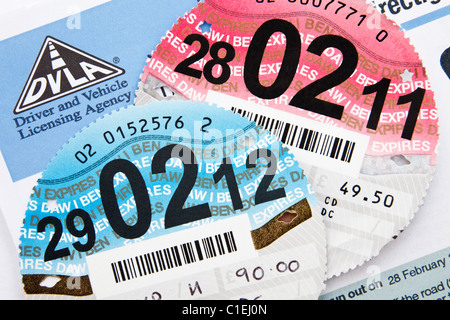 UK DVLA renewal reminder form for renewing road tax disc with old expired and new disc expiring 29th February 2012 leap year Stock Photo