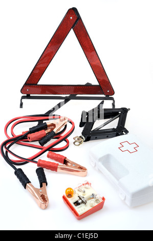 Emergency kit for car - first aid kit, car jack, jumper cables, warning triangle, light bulb kit Stock Photo