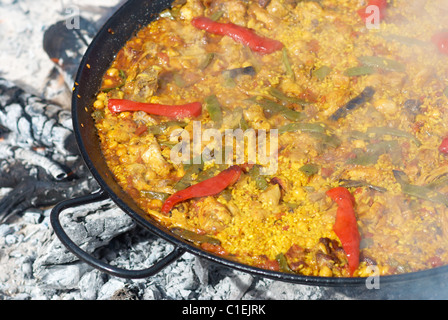 Spanish paella being cooked on an open fire Stock Photo