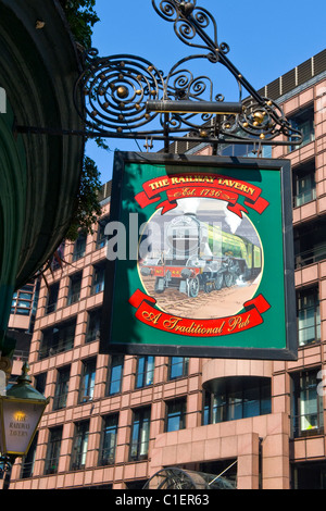 The Railway Tavern Est. 1736 , hanging sign for pub restaurant , once called ' The Cow Shed ' as cattle herded here in 18th cent Stock Photo