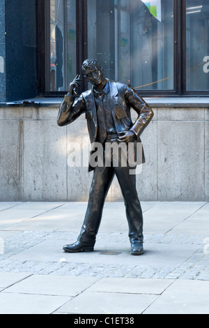 City of London modern contemporary sculpture or statue of The LIFFE Trader or Yuppie on mobile phone by Stephen Melton 1977 Stock Photo