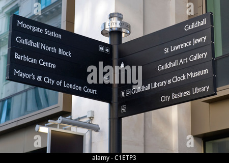 City of London , typical signpost by Guildhall showing local destinations of interest viz Moorgate station , Barbican Centre etc Stock Photo