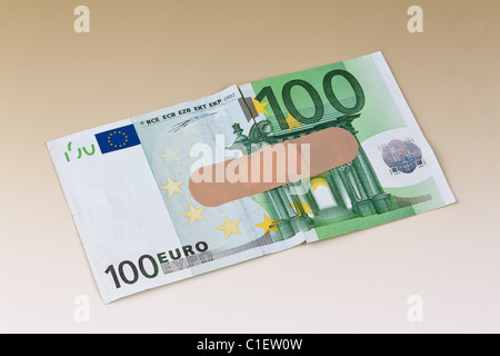 Euro banknotes with a band-aid Stock Photo