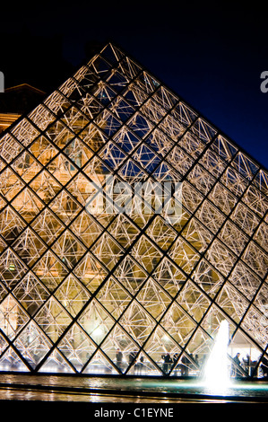 Paris, France - Pyramid at The Louvre Museum, Lit up at Night, Credit Architect: I.M. PEI Stock Photo