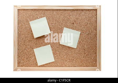 different sticky notes on a cork board isolated on a white background Stock Photo