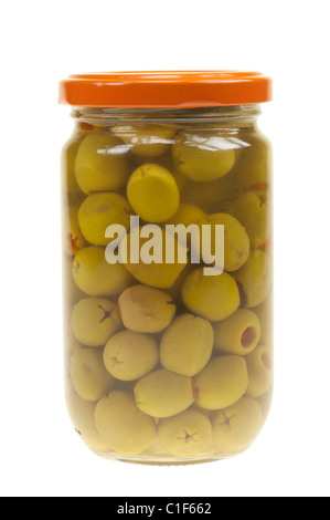 A jar of stuffed green olives isolated on a white background Stock Photo