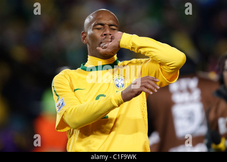 Maicon of Brazil kisses his ring to celebrate after scoring a goal against North Korea during a 2010 World Cup football match. Stock Photo