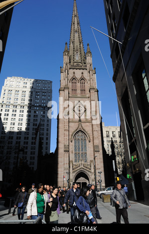 Trinity Church on Broadway at Wall Street in Lower Manhattan dates from the mid-19th century. The architect was Richard Upjohn. Stock Photo