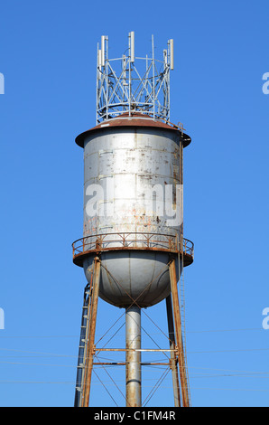 industrial water tower with antenna on top Stock Photo