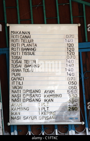 A sign serves as a menu displaying meal prices at an Indian restaurant in Georgetown, Penang, Malaysia. Stock Photo