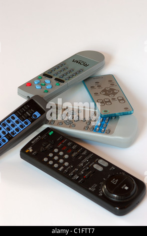 Assorted remote controls for television, dvd's and sterio systems Stock Photo