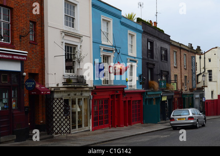 Colourful Houses in Portobello Road, Notting Hill, London. Note the hanging teapot. ARTIFEX LUCIS. Stock Photo