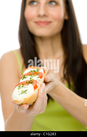 Healthy lifestyle - happy woman eat caprese sandwich Stock Photo
