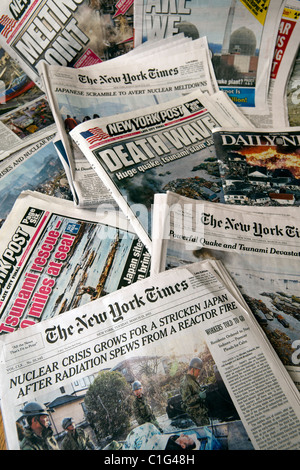 Headlines of New York newspapers report the ongoing crisis in Japan. Stock Photo