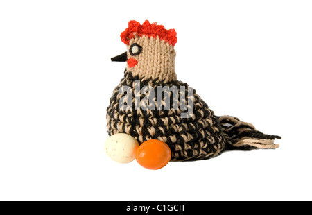Easter chicken knitted from woollen thread and two eggs isolated on a white background Stock Photo