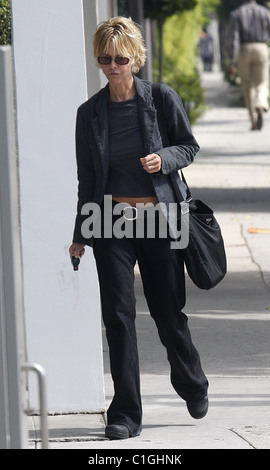 Meg Ryan dressed in black and walking in heavy boots heading for a hair dresser appointment West Hollywood, California - Stock Photo