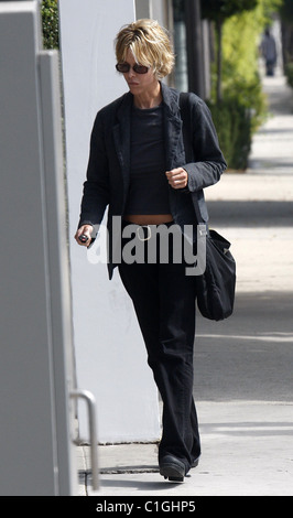 Meg Ryan dressed in black and walking in heavy boots heading for a hair dresser appointment West Hollywood, California - Stock Photo