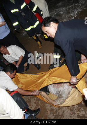 Viaduct collapse in China Rescuers investigate the rubble after a viaduct collapse in Zhuzhou City, China. Six people died and Stock Photo