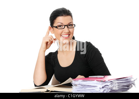 Young student woman learning at the desk, isolated on white Stock Photo