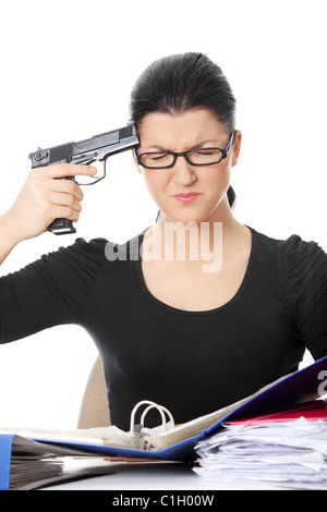 Female killing her self while filling out tax forms while sitting at her desk. Isolated Stock Photo