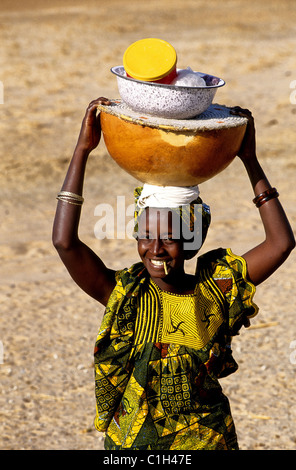 Senegal, Diourbel Region, Touba, Peuhl young woman selling fresh cheese Stock Photo