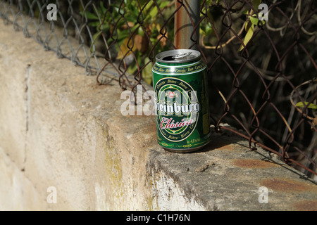 Beer can left on wall top. Stock Photo