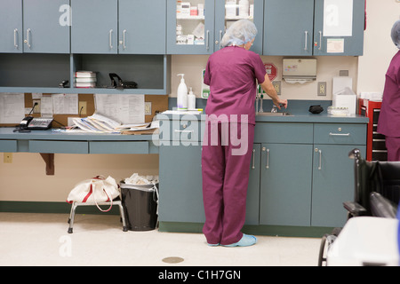 Female nurse washing her hands Stock Photo
