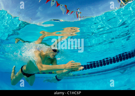 College swimmer doing breaststroke during Orange Bowl Swimming Classic competition. Stock Photo