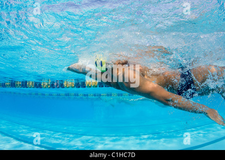 Male swimmers compete in a backstroke event at the annual Orange Bowl Swimming Classic, Key Largo, Florida Stock Photo