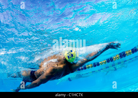 Male swimmers compete in a backstroke event at the annual Orange Bowl Swimming Classic, Key Largo, Florida Stock Photo