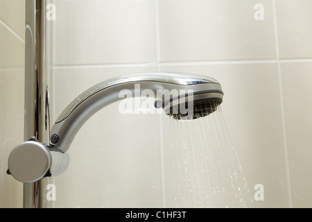 Water flows from a shower head Stock Photo