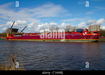 Unloading Alstom National Grid Electrical Transformer, transport of heavy loads from the barge Terra Marique on the River Ribble, Preston, UK Stock Photo