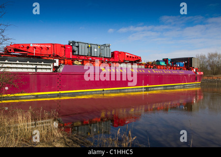 Unloading Alstom National Grid Electrical Transformer, transport of heavy loads from the barge Terra Marique on the River Ribble, Preston, UK Stock Photo