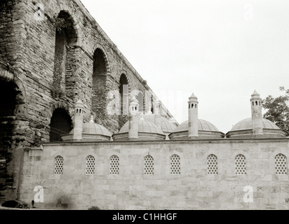 Small minarets of a mosque at Valens Aqueduct in Istanbul in Turkey in Middle East Asia. History Historical Religion Architecture Building Travel Stock Photo