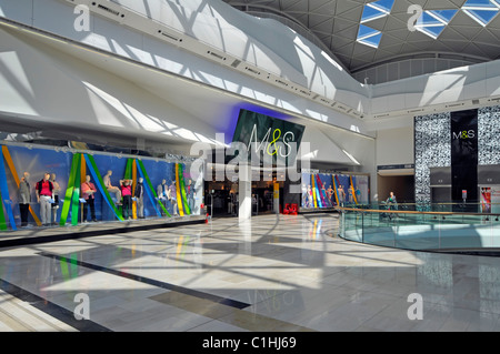 Marks and Spencer retail store window displays & M&S sign above entrance inside Westfield shopping centre Shepherds Bush White City London England UK Stock Photo