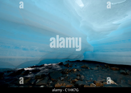 Blue ice glacier over stones. East Sayan mountains. Tunkinskie Goltsy. Siberia. Russia. Stock Photo