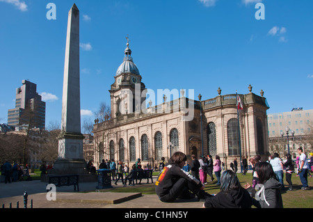 Teenagers hang out in the grounds of Birmingham's St Phillip's Cathedral on a Saturday afternoon. England. Stock Photo