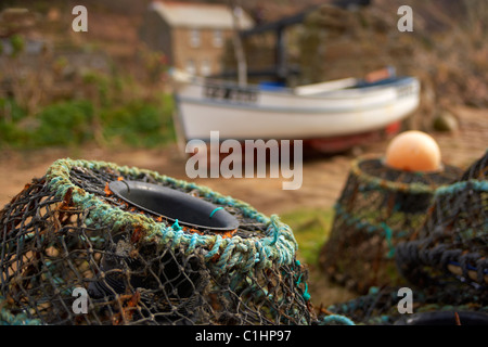 Lobster pots on the slipway at Penberth Cove on the Cornish coast UK Stock Photo