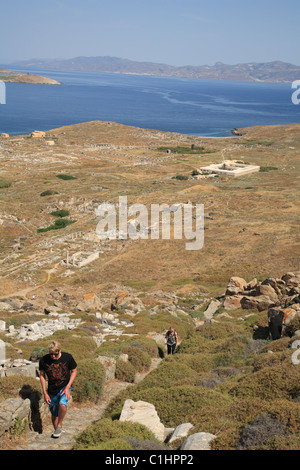 Two people climbing Mt Kynthos, Delos, Cyclades Islands, Greece Stock Photo