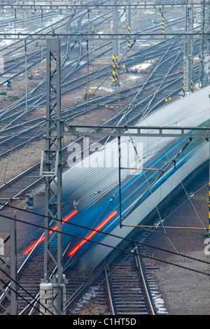 fast train passing in high speed - blurred motion - view from above Stock Photo