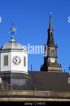 Seen from Newcastle quayside the clocks of the guildhall and All Saints church Newcastle upon Tyne NE England UK Stock Photo