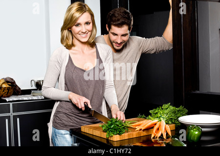 Young couple in kitchen Stock Photo