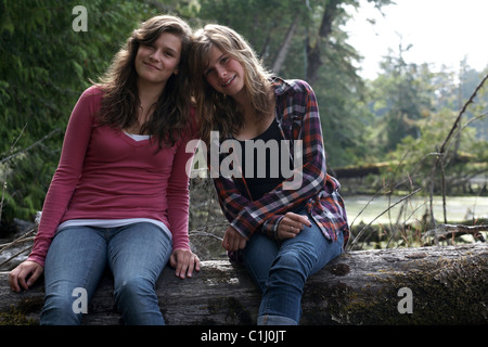 Portrait of Two Teenage Girls, Jensen's Bay, Tofino, Vancouver Island, British Columbia, Canada Stock Photo