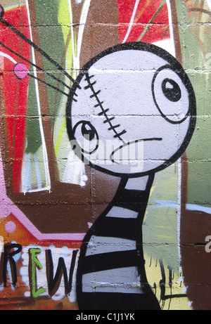 Cartoon Image of Worried Little Worm with Sad Face, Graffiti Image Painted on Brick Wall, Barcelona, Spain Stock Photo